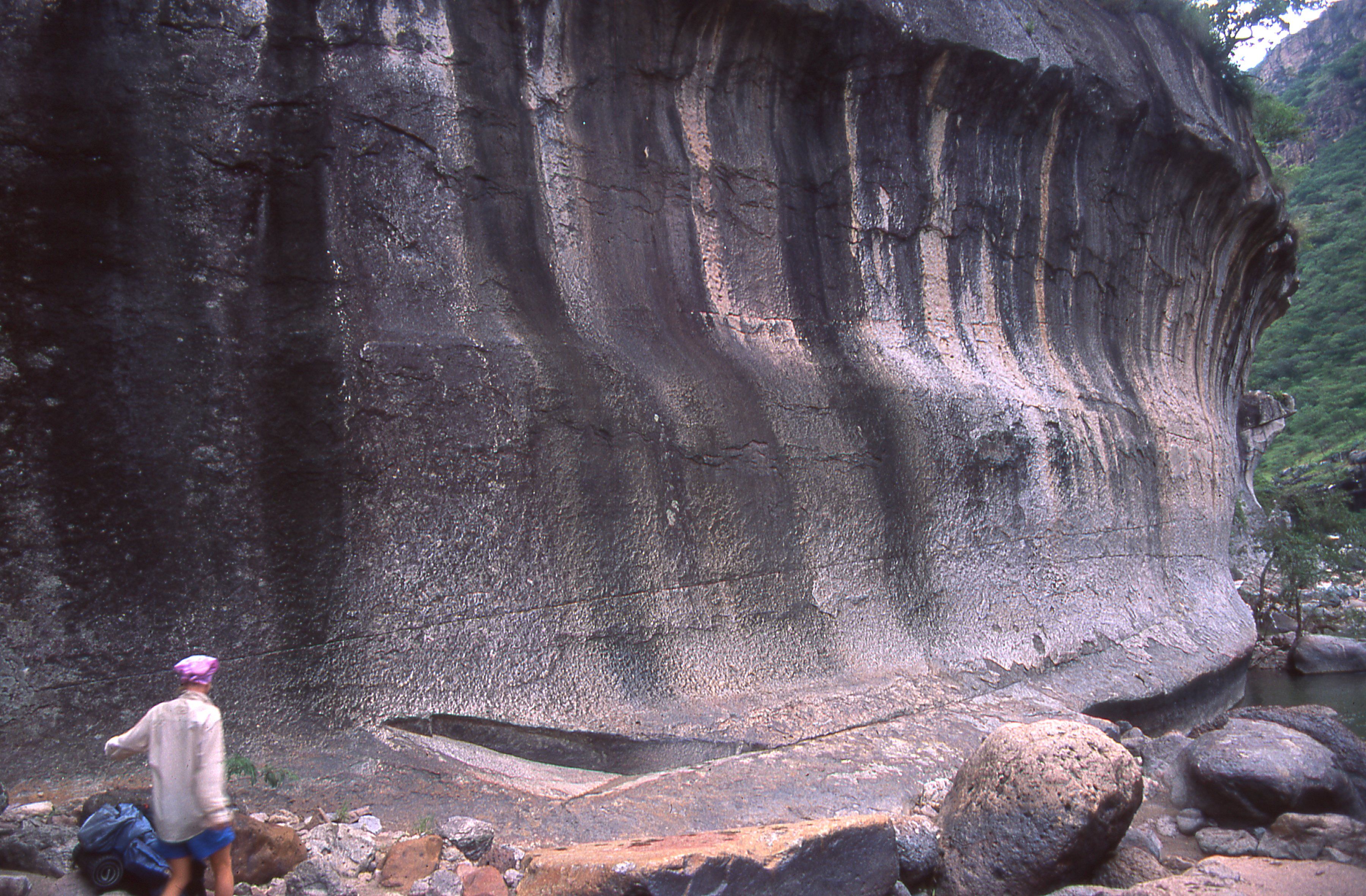 A naturally carved bend in the volcanic tuff beckons us further.